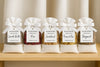 5 pack luxury fragrance scented bags on a wooden surface with a neutral background