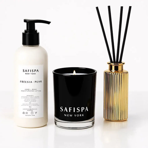 luxury holiday aromatherapy gift set with Freesia & Pear candle, moisturizing lotion, and reed diffuser — elegant gold and white aesthetic for seasonal gifting