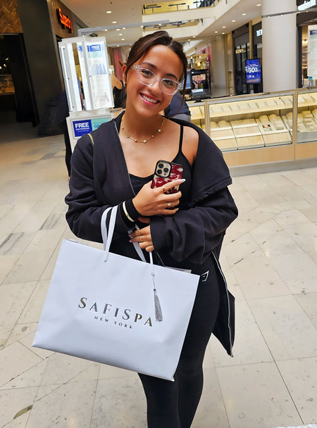 Happy customer posing with SaFiSpa bag and gift set