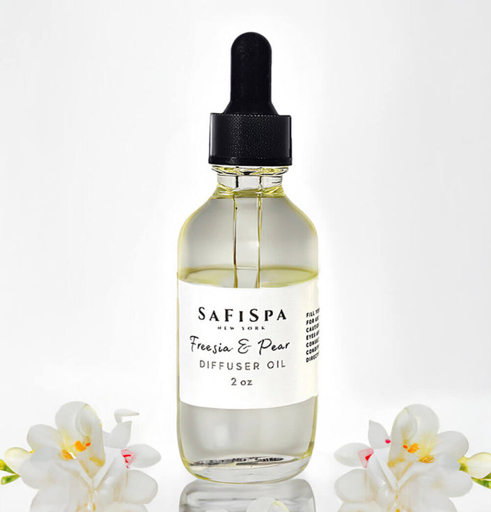 Pure Freesia and Pear essential oil in a glass bottle, perfect for aromatherapy and relaxation