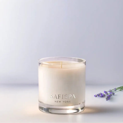 Safispa New York Lavender luxury soy candle in clear glass vessel with silver logo, premium home fragrance inspired by calming French lavender, spa-quality clean burn candle.