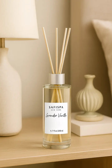 Safispa diffuser bottle with sticks on a wooden surface