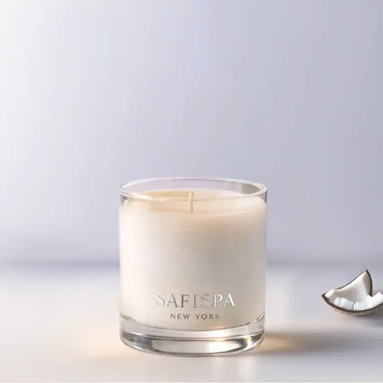 Safispa New York Mango Coconut luxury soy candle in clear glass jar, tropical fruit home fragrance with creamy coconut and ripe mango notes.