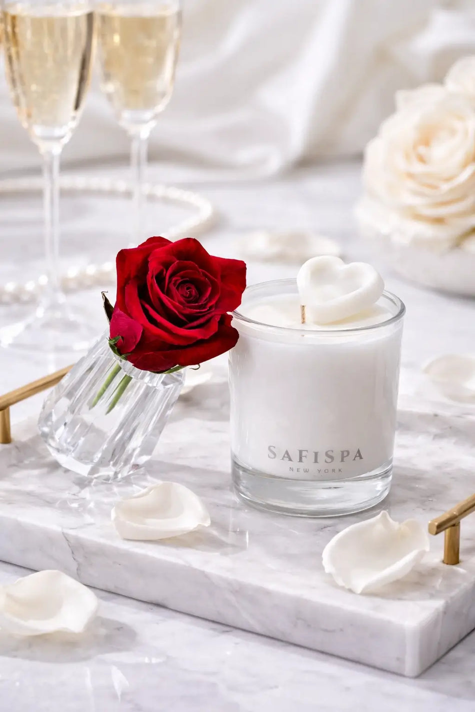 Safispa candle with a red rose on a marble surface