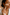 Close-up of a woman using SaFiSpa anti-aging facial roller and gua sha tool for natural skincare and improved circulation