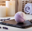 Lavender vanilla bath bomb fizzing in bathtub - Relaxing aromatherapy for a spa-like experience