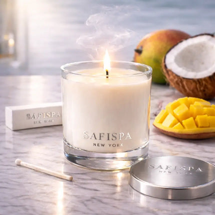 Safispa candle with mango and coconut on a marble surface