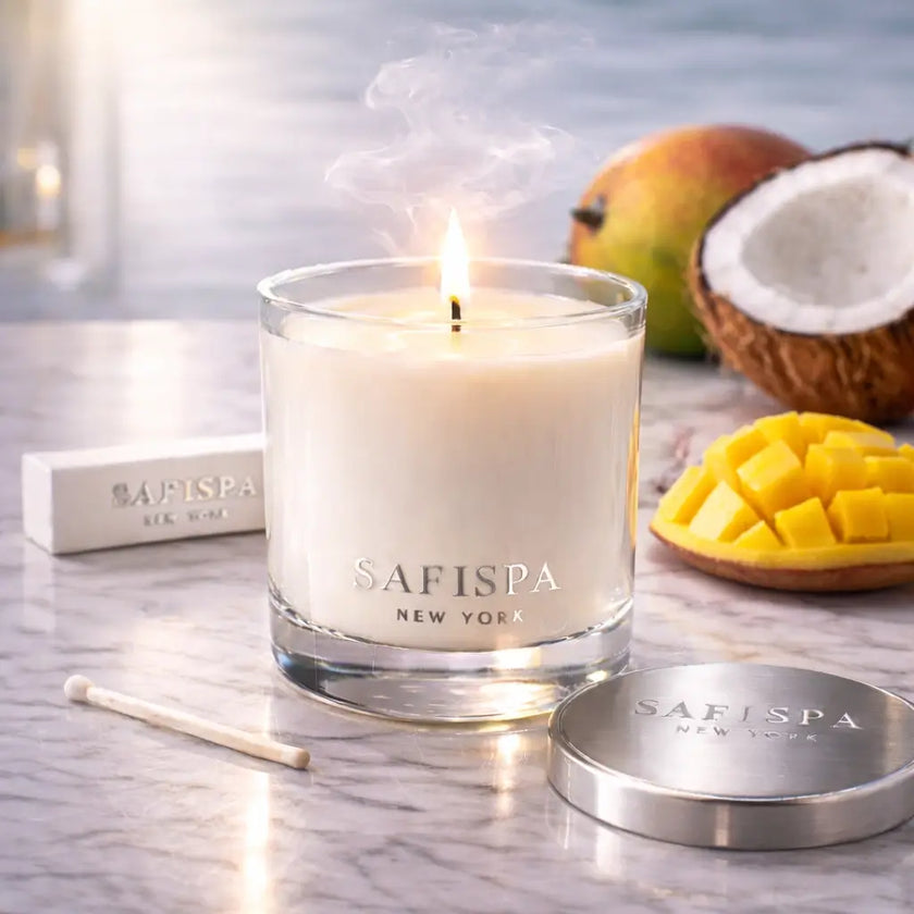 Safispa candle with mango and coconut on a marble surface