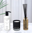 Safispa products including a bottle, candle, and diffuser on a light background