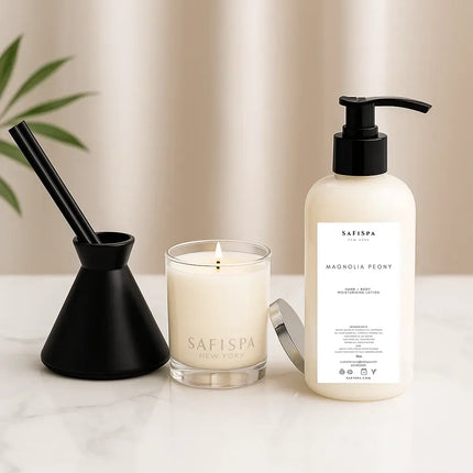 Luxury Fragrance gift lavender vanilla candle, diffuser, and bottle on a light surface with a white curtain background