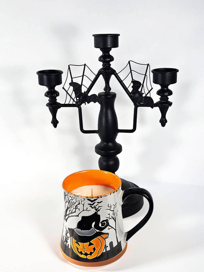 A Halloween-themed candle with a pumpkin spice fragrance. Shopw now