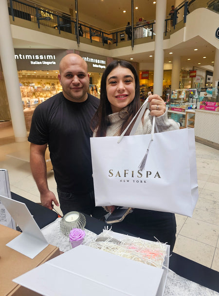 Freshly lit SaFiSpa Belle Rose candle at golden hour