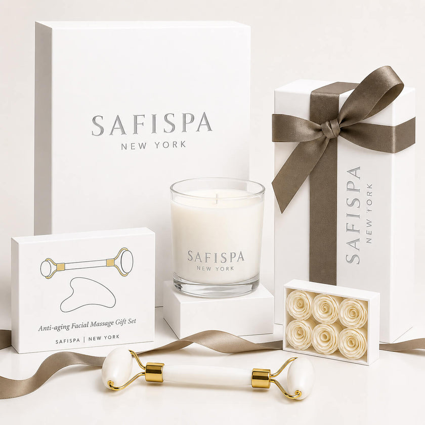 Luxury candle gift set by SaFiSpa New York featuring a premium soy candle, facial massage roller, gua sha stone, handmade soap flowers, elegant white gift boxes, and luxury spa accessories for self-care, birthdays, weddings, anniversaries, Mother's Day, and thoughtful gifting.