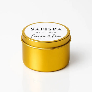 Gold candle tin with white lid featuring 'Safispa New York' on a white background