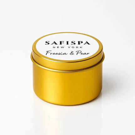 Gold candle tin with white lid featuring 'Safispa New York' on a white background