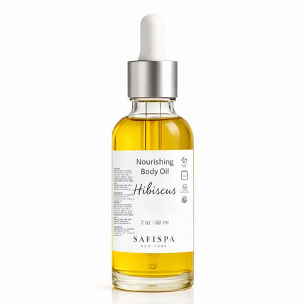 Hibiscus nourishing body oil by SafiSpa New York in a clear glass dropper bottle 