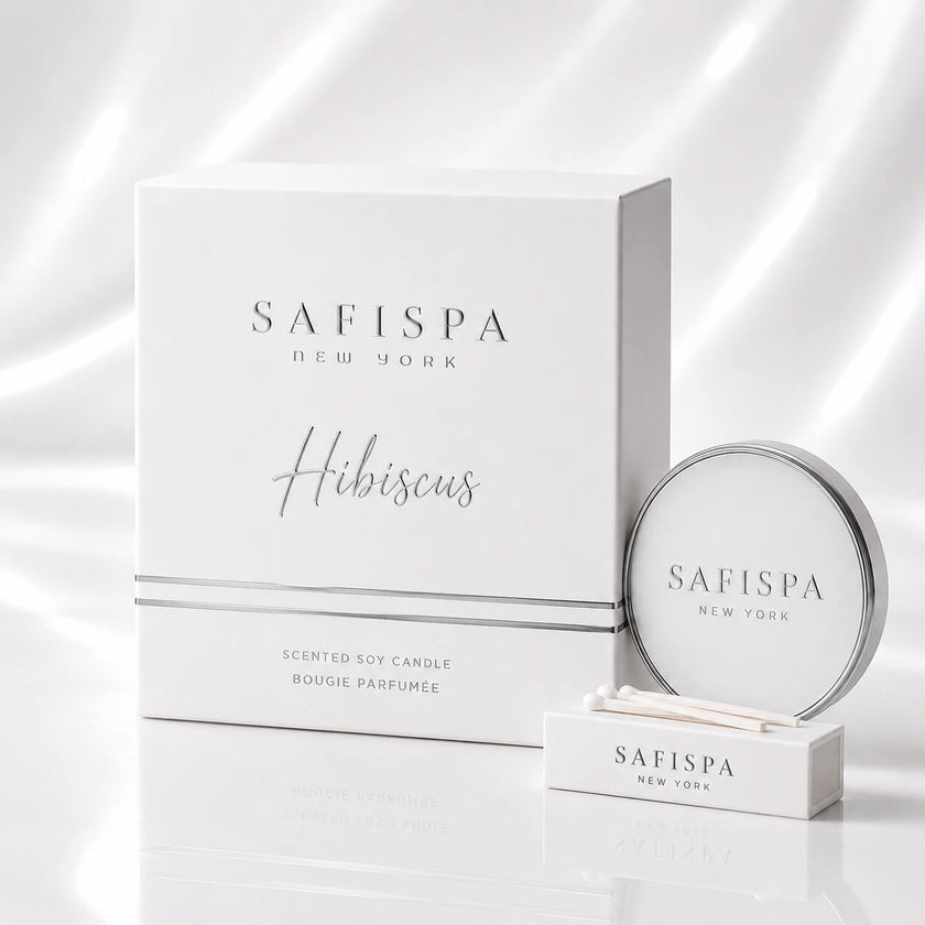 SaFiSpa New York hibiscus scented candle luxury packaging with elegant silver typography, modern minimalist design, premium soy candle branding and glossy white aesthetic