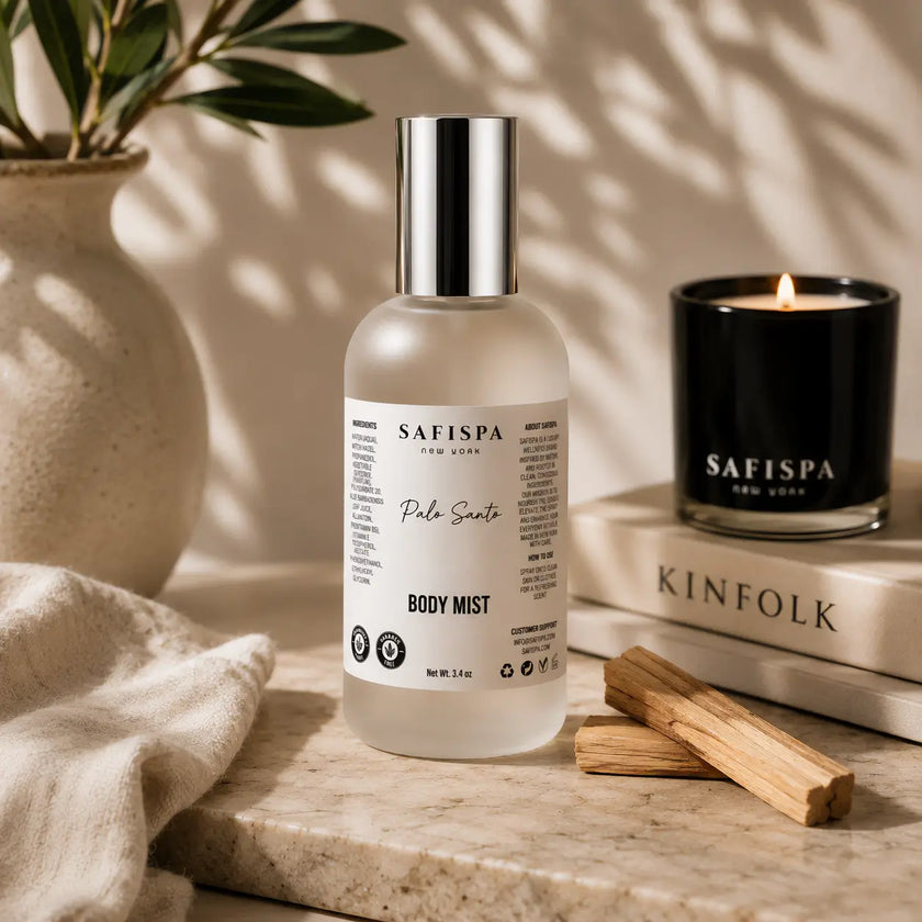 SaFiSpa Palo Santo body mist with Palo Santo wood and luxury scented candle in a warm self-care setting