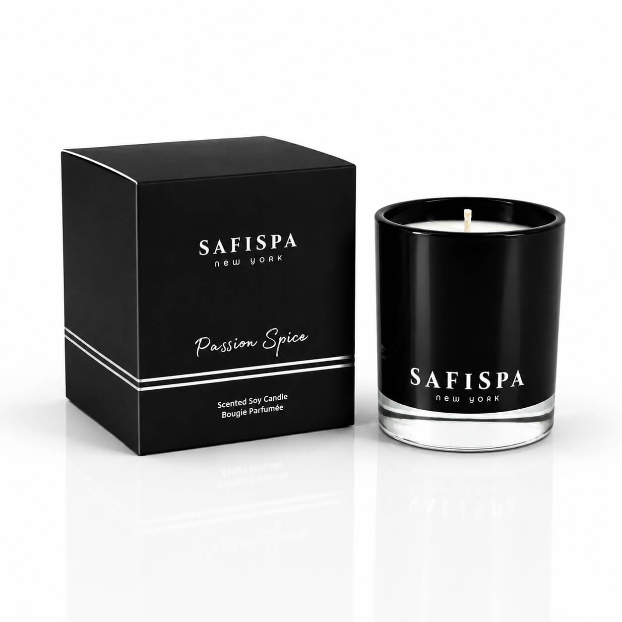 Safispa Passion Spice scented soy candle in a black glass jar next to its black packaging box, clean luxury candle