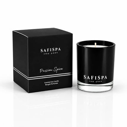 Safispa Passion Spice scented soy candle in a black glass jar next to its black packaging box, clean luxury candle
