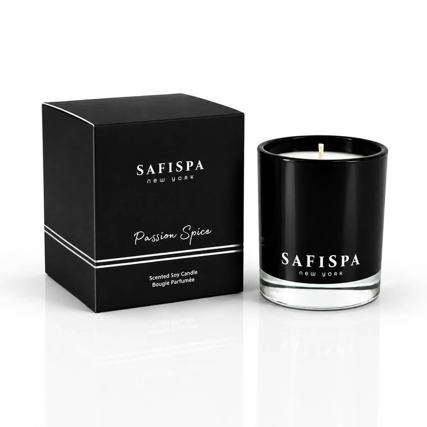 Safispa Passion Spice scented soy candle in a black glass jar next to its black packaging box, clean luxury candle
