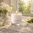 Luxury Freesia and Pear candle by SaFiSpa New York creating fresh floral aromatherapy ambiance in an elegant home interior.