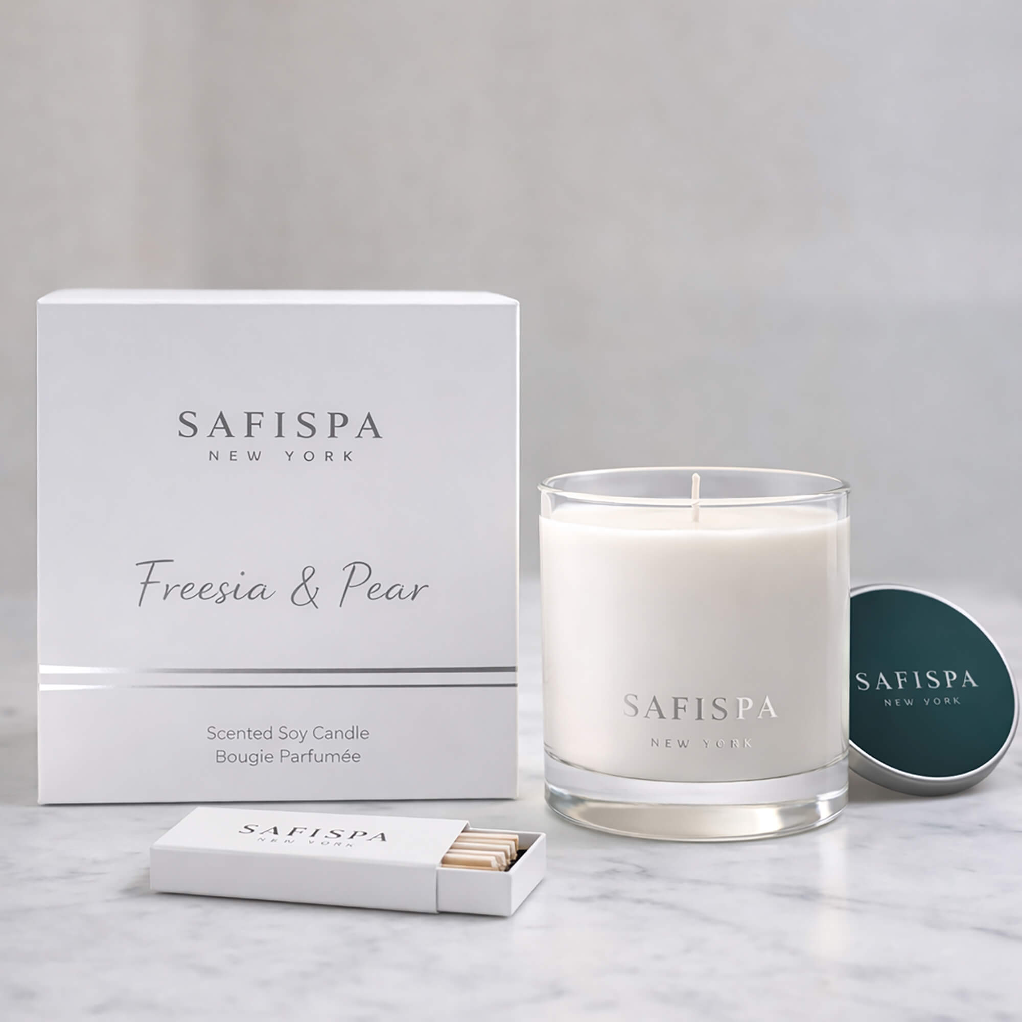 SaFiSpa New York Freesia and Pear scented candle with luxury white box packaging, premium soy wax candle and silver lid.