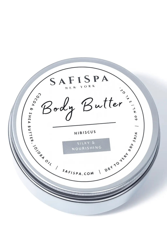 SaFiSpa Hibiscus Body Butter in silver tin, made with cocoa butter, shea butter, and jojoba oil, labeled silky and nourishing for dry to very dry skin.