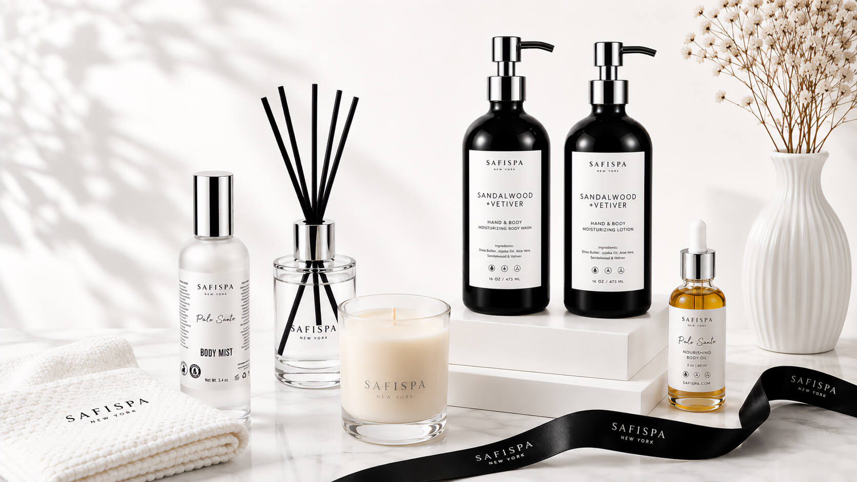 SaFiSpa luxury home fragrance and body care collection featuring handcrafted soy candle, reed diffuser, nourishing body oil, Palo Santo body mist, premium hand and body lotion, body wash, and luxury spa essentials handcrafted in New York.