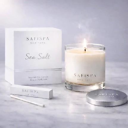 Sea Salt luxury scented soy candle by Safispa New York in minimalist glass jar with silver embossed box, premium clean burning coastal scented candle for home fragrance