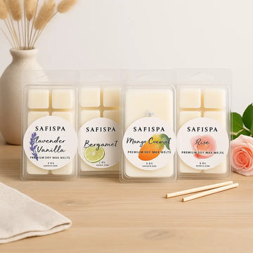 Four SAFISPA wax melt packages on a wooden surface with decorative elements.