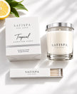 Tropical Signature candle with white fragrance box, silver lid and matchbox, styled with lemon and bergamot.