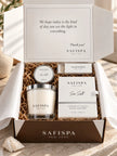 SaFiSpa Sea Salt luxury scented candle gift presentation with clear glass soy candle, white gift packaging and premium accessories
