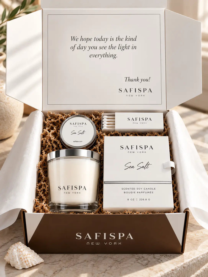 SaFiSpa Sea Salt luxury scented candle gift presentation with clear glass soy candle, white gift packaging and premium accessories