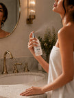 Woman applying shea butter body mist spray on skin hydrating fragrance daily routine soft glowing skin