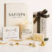 Safispa New York gift set with candle, facial roller, and facial massage tool on a white background