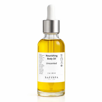 Unscented nourishing body oil by SafiSpa New York in a clear glass bottle with white pump on a pure white background